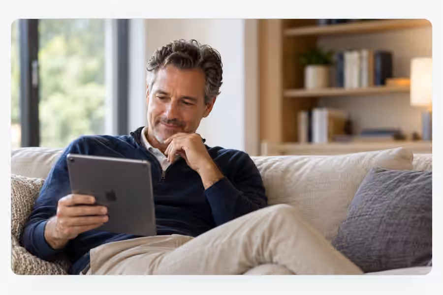 A golfer at home in casual clothes, continuing a conversation away from the course
